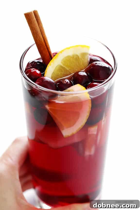 Sparkling Cranberry Orange Sangria Recipe -- quick and easy to make, and perfect for the holidays or any good party! | gimmesomeoven.com