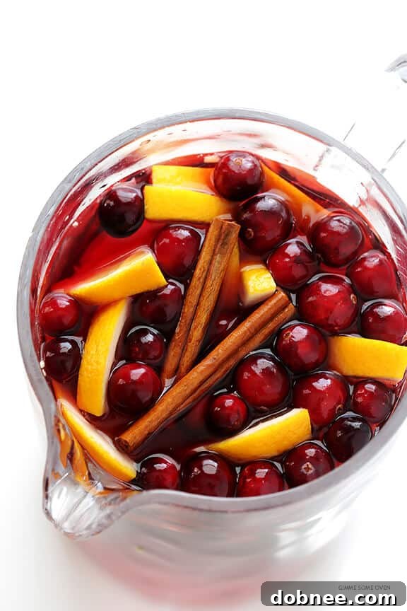 Sparkling Cranberry Orange Sangria Recipe -- quick and easy to make, and perfect for the holidays or any good party! | gimmesomeoven.com