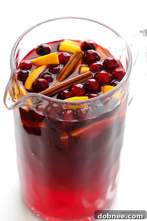 Sparkling Cranberry Orange Sangria Recipe -- quick and easy to make, and perfect for the holidays or any good party! | gimmesomeoven.com