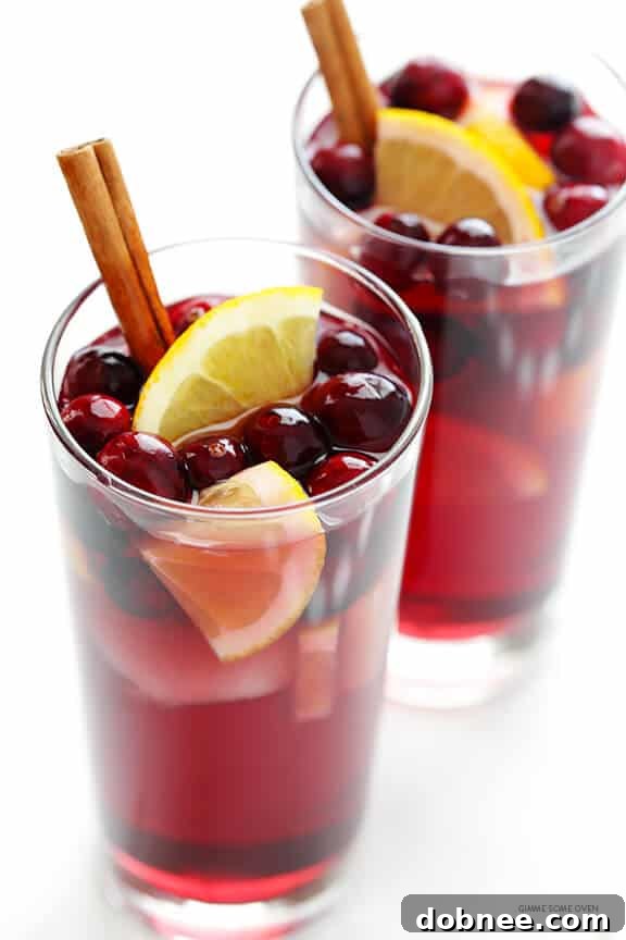 Sparkling Cranberry Orange Sangria Recipe -- quick and easy to make, and perfect for the holidays or any good party! | gimmesomeoven.com