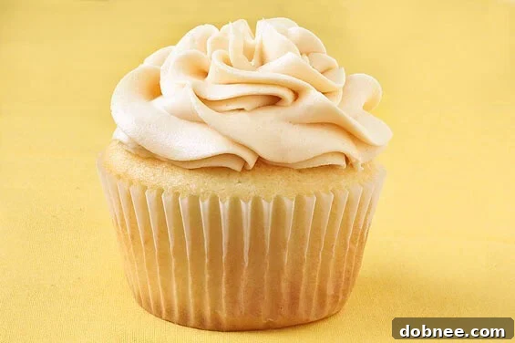 Delicious Vanilla Almond Cupcakes topped generously with homemade Salted Caramel Buttercream, ready to be enjoyed.