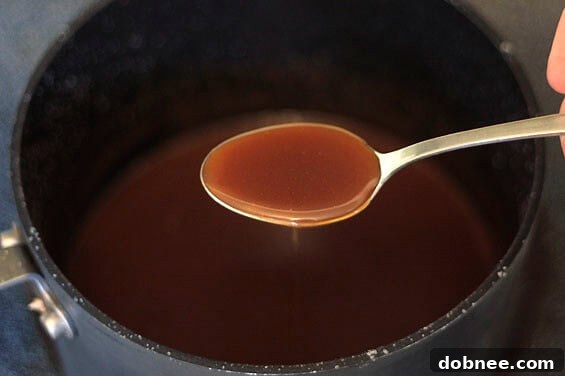 A trio of Vanilla Almond Cupcakes with fluffy Salted Caramel Buttercream, ready to be picked up and enjoyed.