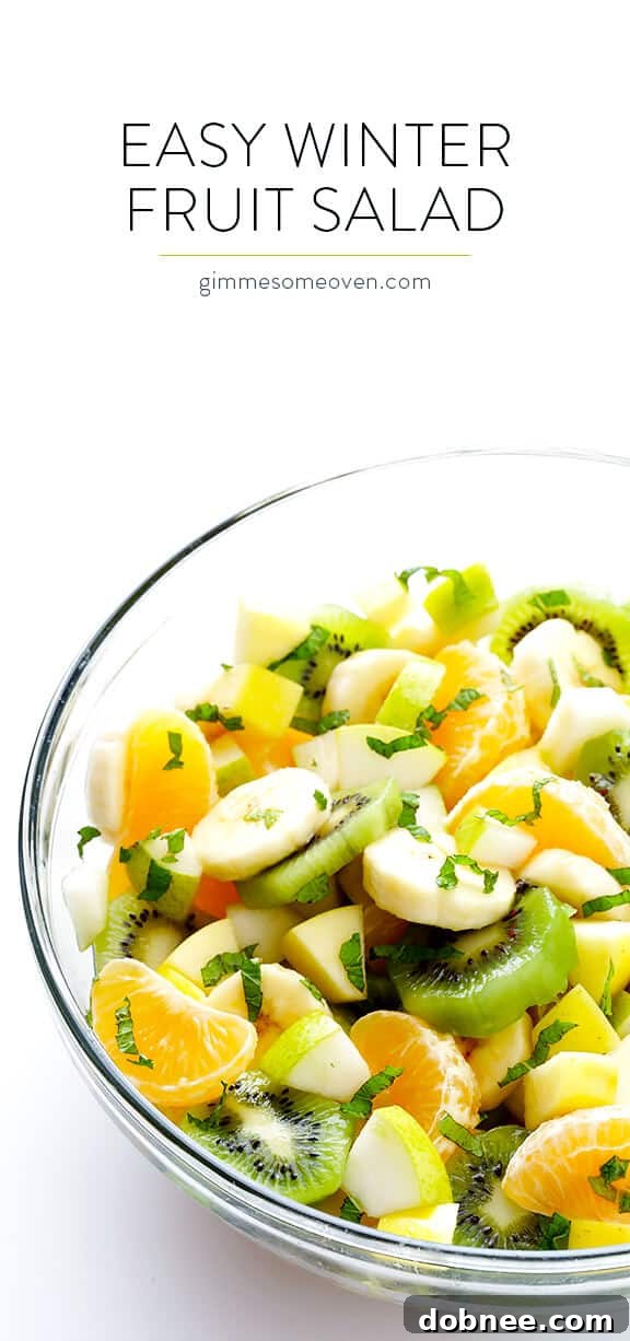 Full bowl of Easy Winter Fruit Salad with fresh mint