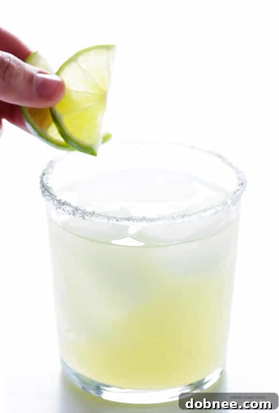 Serving Mezcal Margaritas on the Rocks with Lime