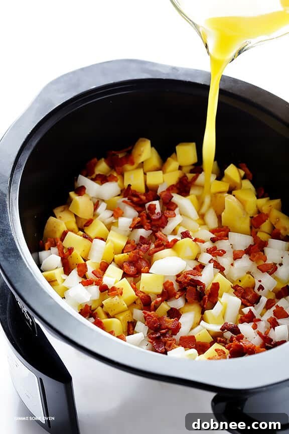 Freshly chopped Yukon Gold potatoes and diced onion, ready for the slow cooker, alongside cooked bacon bits