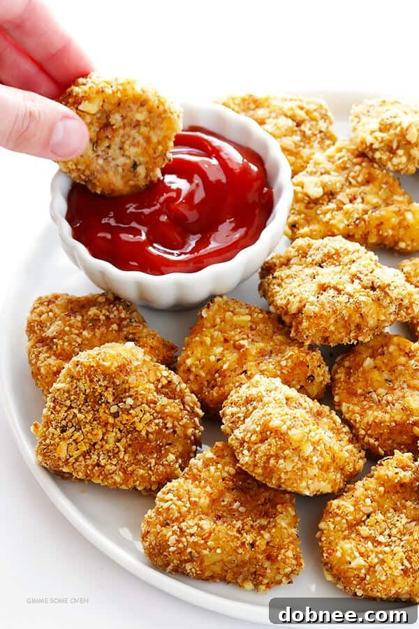 Delicious, golden-brown Almond-Crusted Chicken Nuggets, baked for a healthier twist.