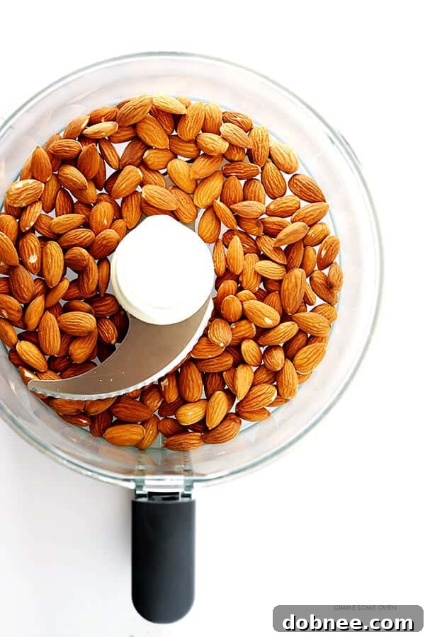 Overhead view of various seasoning spices laid out, ready to be mixed with ground almonds for the chicken nugget coating.