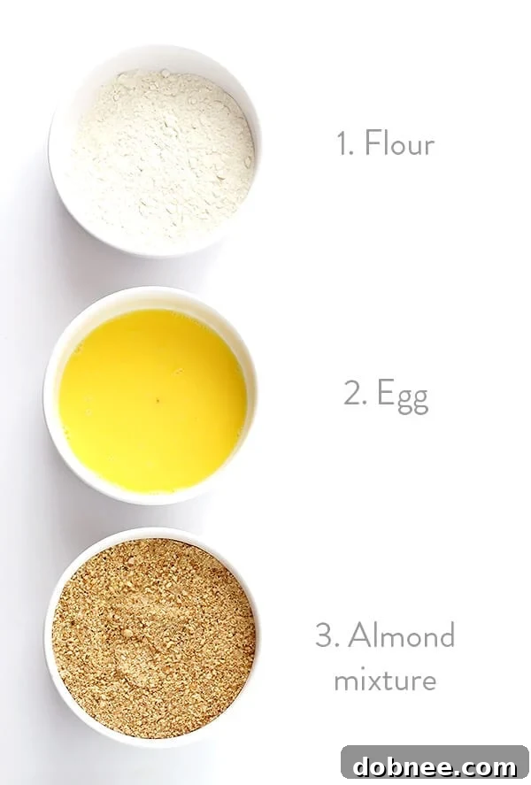 Finely ground almonds mixed with spices in a bowl, forming the flavorful crust for chicken nuggets.