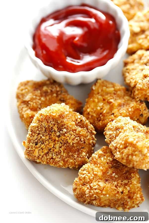 A vibrant spread of Almond-Crusted Chicken Nuggets with various dipping sauces, perfect for a party setting.