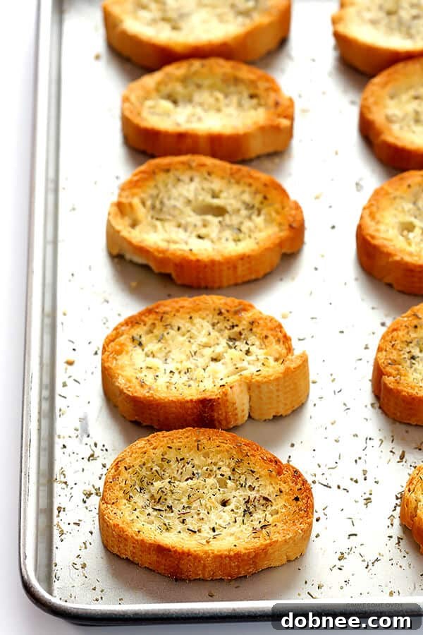 Freshly tossed Kale Caesar Salad with bright green dressing, ready to be served.