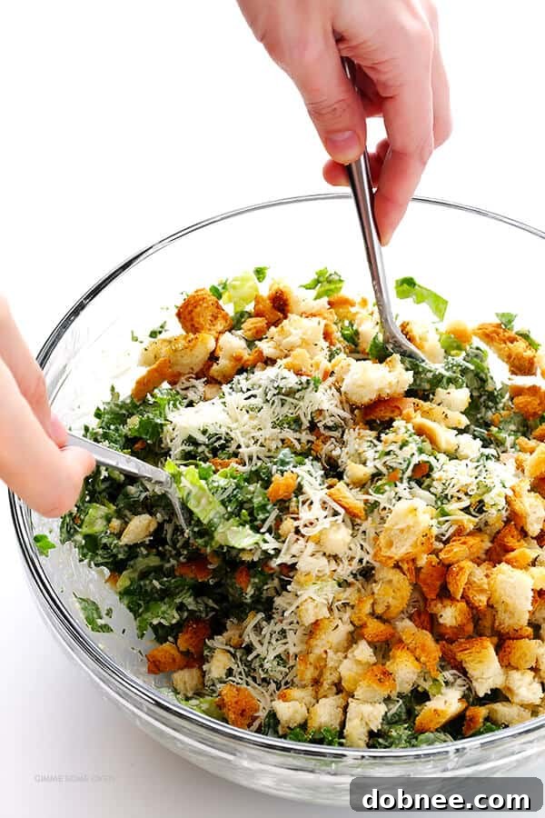 Homemade croutons being prepared from toasted French bread for a Kale Caesar Salad.