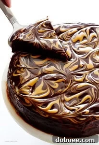 Peanut Butter Flourless Chocolate Cake with a decadent chocolate and peanut butter swirl topping.