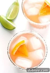 Grapefruit Margarita with a salted rim and fresh citrus slices, presented as a recipe card image