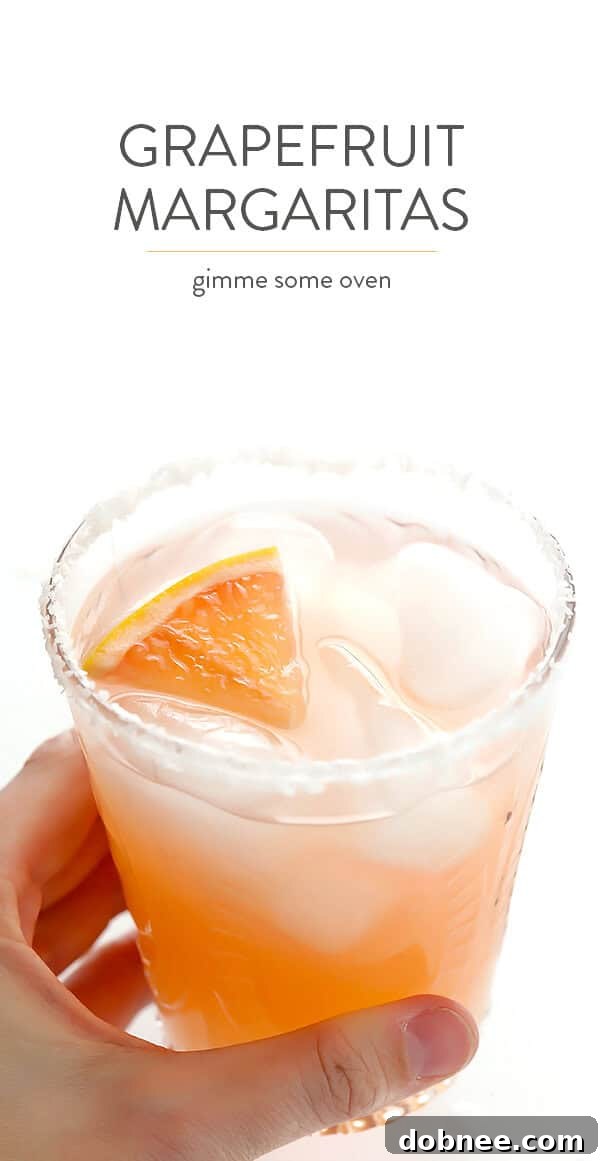 Final shot of a vibrant grapefruit margarita with a citrus slice, perfectly crafted and ready to be enjoyed