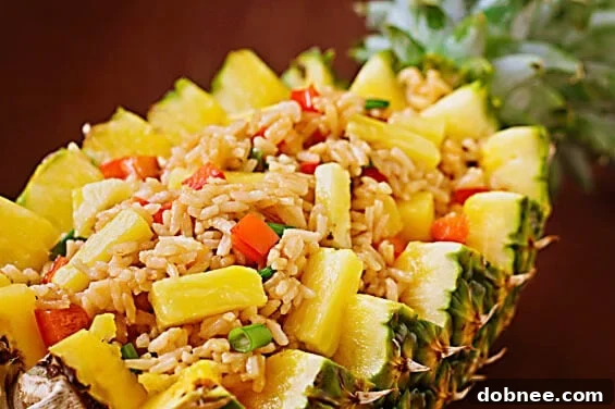 Delicious Pineapple Fried Rice served in a carved pineapple