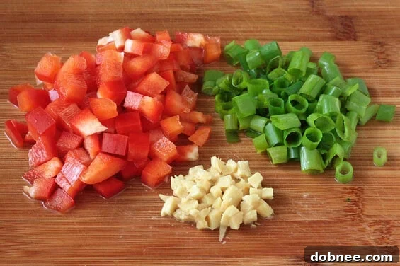 Pineapple Fried Rice garnished with fresh herbs and chili flakes