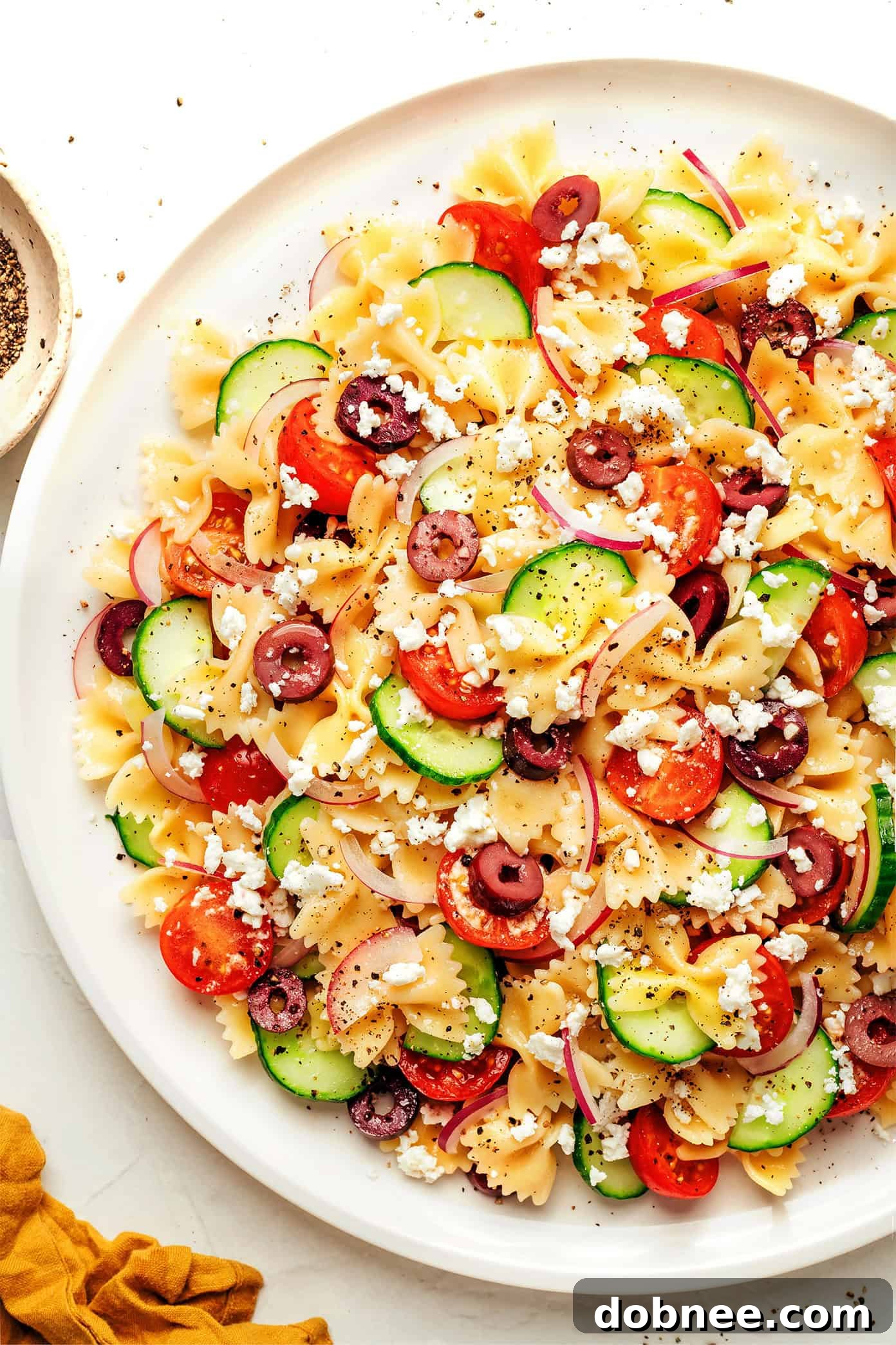 Sun-Drenched Mediterranean Pasta 2 A vibrant bowl of Mediterranean Pasta Salad with a lemon-herb vinaigrette