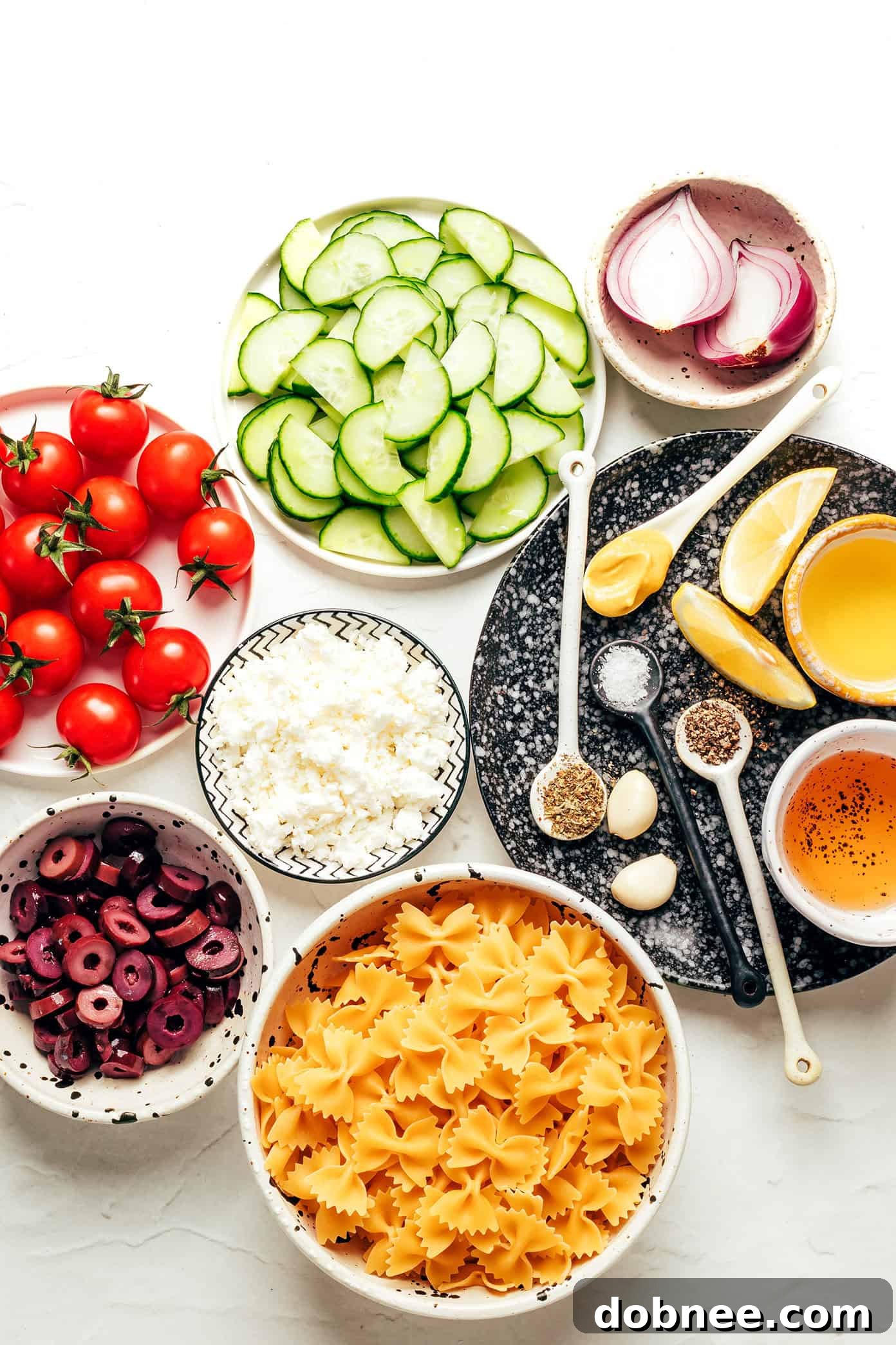Sun-Drenched Mediterranean Pasta 3 Close-up of Mediterranean Pasta Salad ingredients before tossing