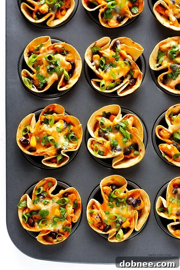 Colorful Easy Enchilada Cups arranged on a wooden board, ready to be served