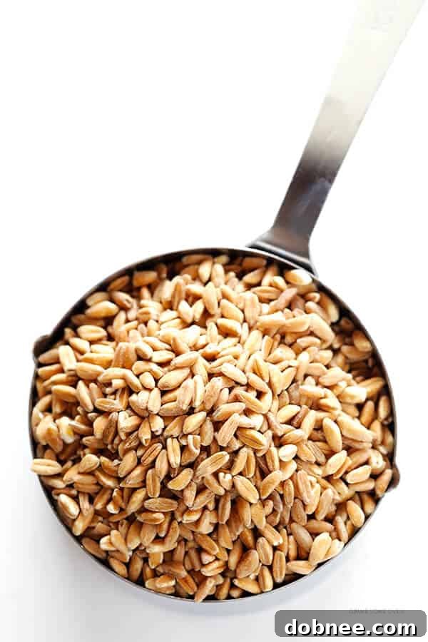 The cover of Andie Mitchell's cookbook, Eating In The Middle, featuring a warm and inviting image.