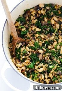 Creamy Farro with White Beans and Kale, a delicious and hearty vegetarian recipe.