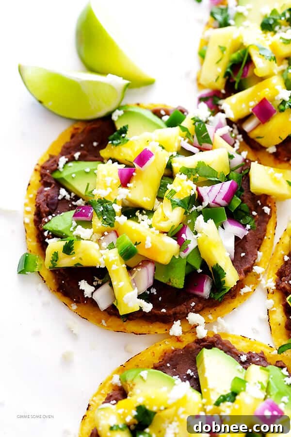 Fully assembled Pineapple Black Bean Tostada, showcasing a perfect blend of colors and textures, ready to be enjoyed.