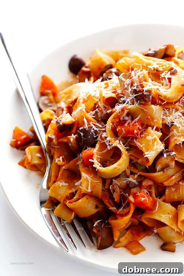 Closeup of chopped mushrooms, ready for a delicious vegetarian bolognese sauce. Includes cremini, shiitake, and porcini mushrooms.