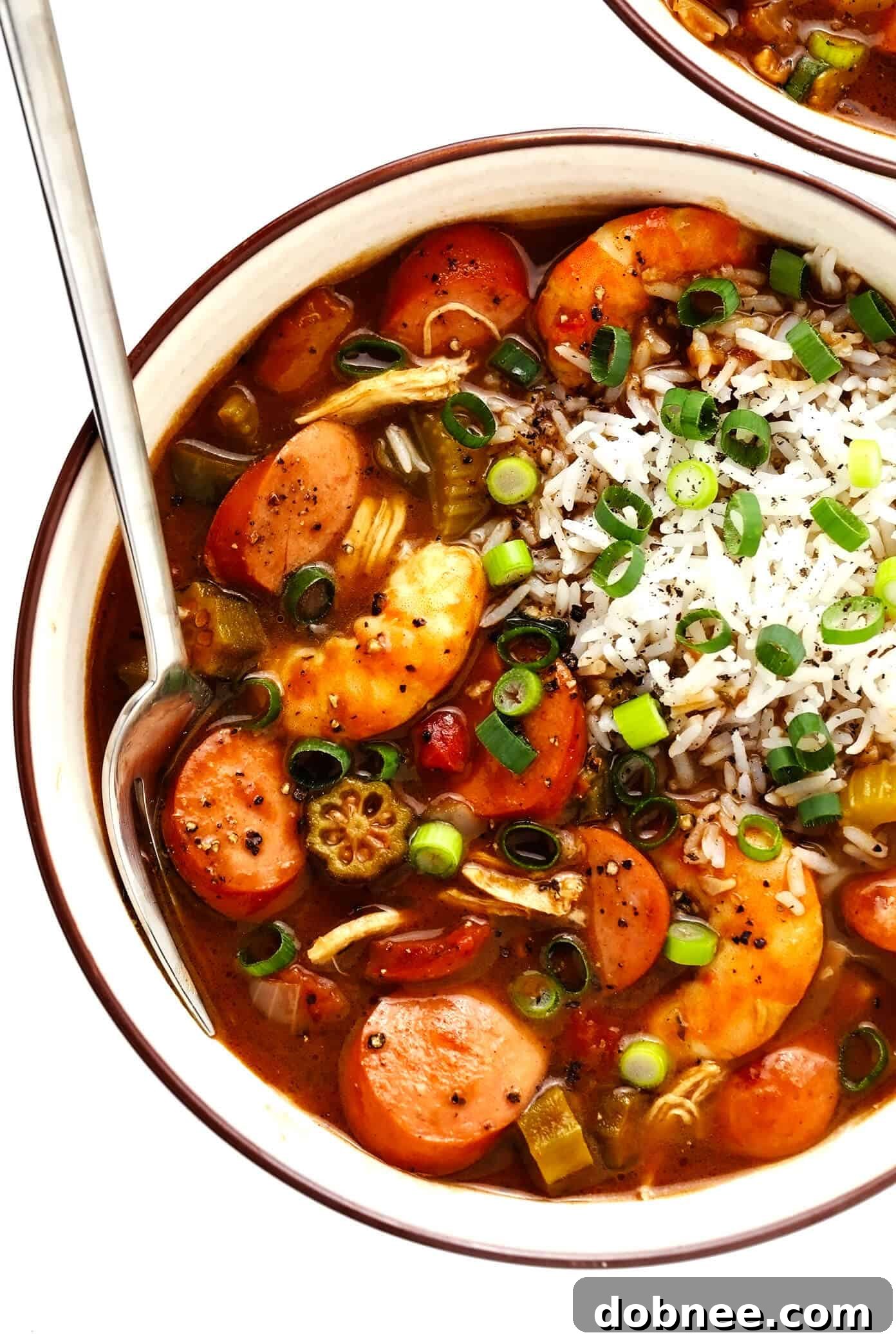 Rich and Hearty Gumbo with Chicken, Sausage, and Shrimp served over rice, perfect for a New Orleans-inspired meal or Mardi Gras celebration.