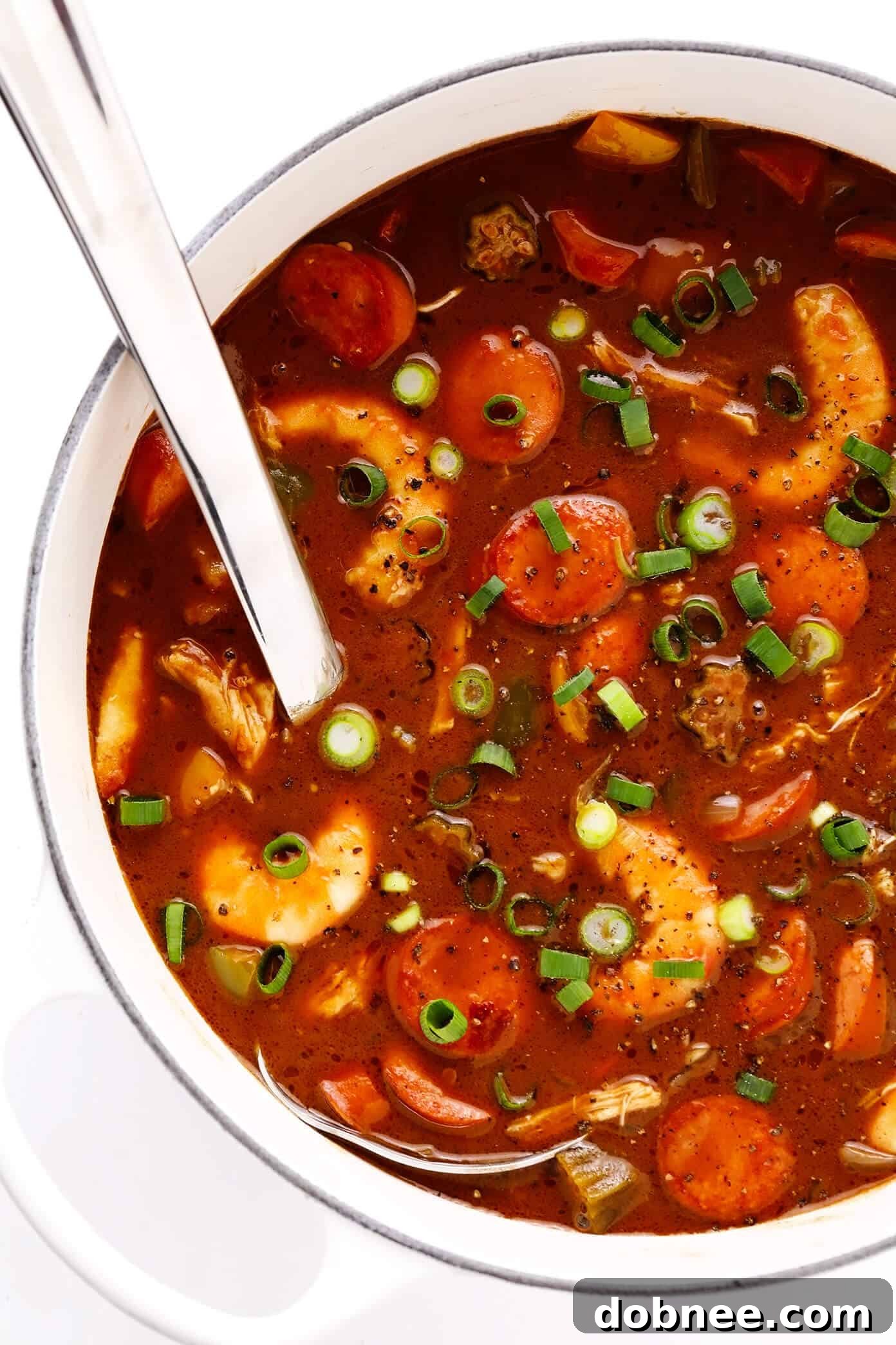 Pot of rich Chicken, Sausage and Seafood Gumbo, simmering beautifully on the stove, ready to be served.
