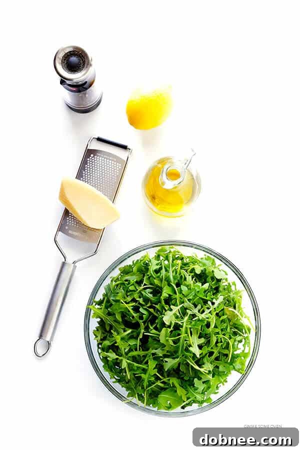 Close-up of the delicious 5-Ingredient Arugula Salad with Parmesan, Lemon, and Olive Oil, showcasing its freshness.