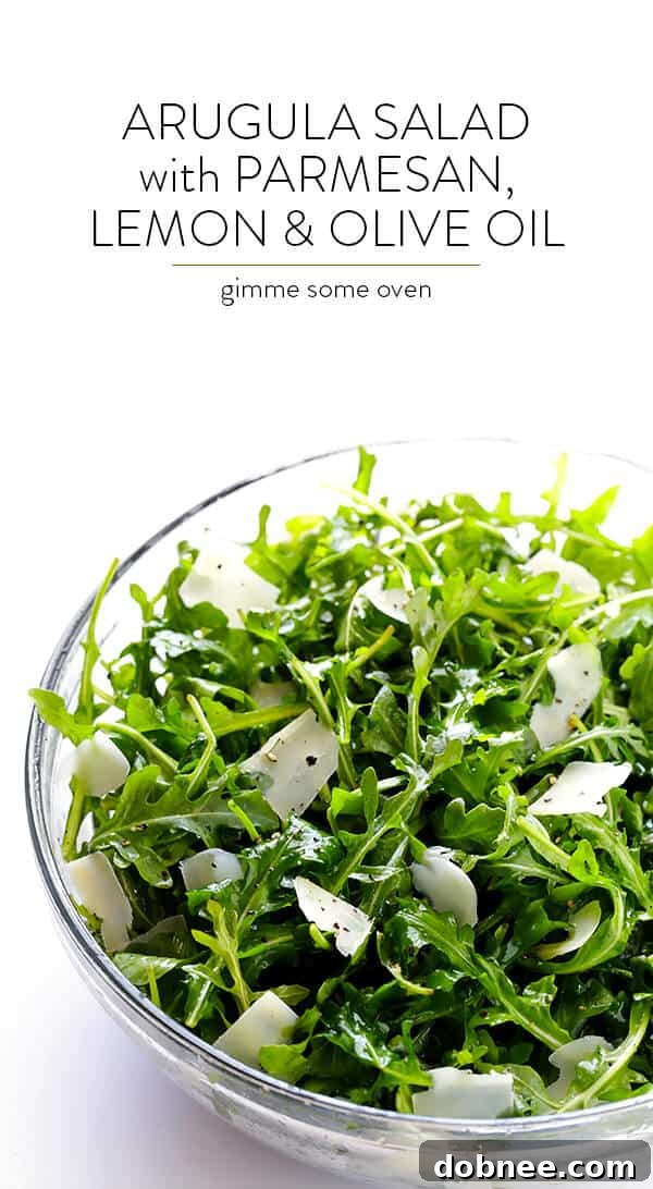 Final presentation of the Arugula Salad with Parmesan, Lemon, and Olive Oil, emphasizing its appeal.