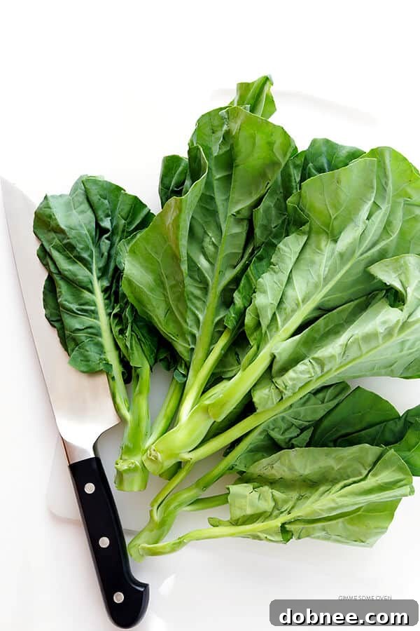 Close-up of fresh Chinese broccoli, an essential ingredient for authentic Pad See Ew, showcasing its thick stems and dark green leaves.