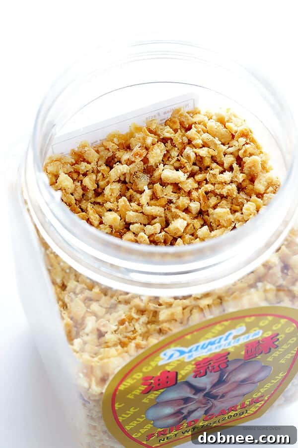 A small bowl filled with crispy golden fried garlic, a delicious garnish for Pad See Ew and other Thai dishes.