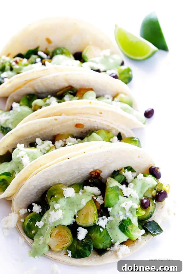 Delicious Brussels Sprouts Tacos with creamy avocado sauce – perfect for quick, healthy weeknight dinners or fun gatherings. | gimmesomeoven.com