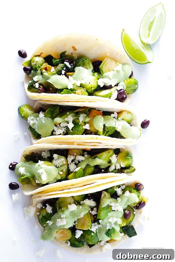 A pan filled with the savory Brussels sprouts and black bean taco filling, perfectly seasoned and cooked. | gimmesomeoven.com