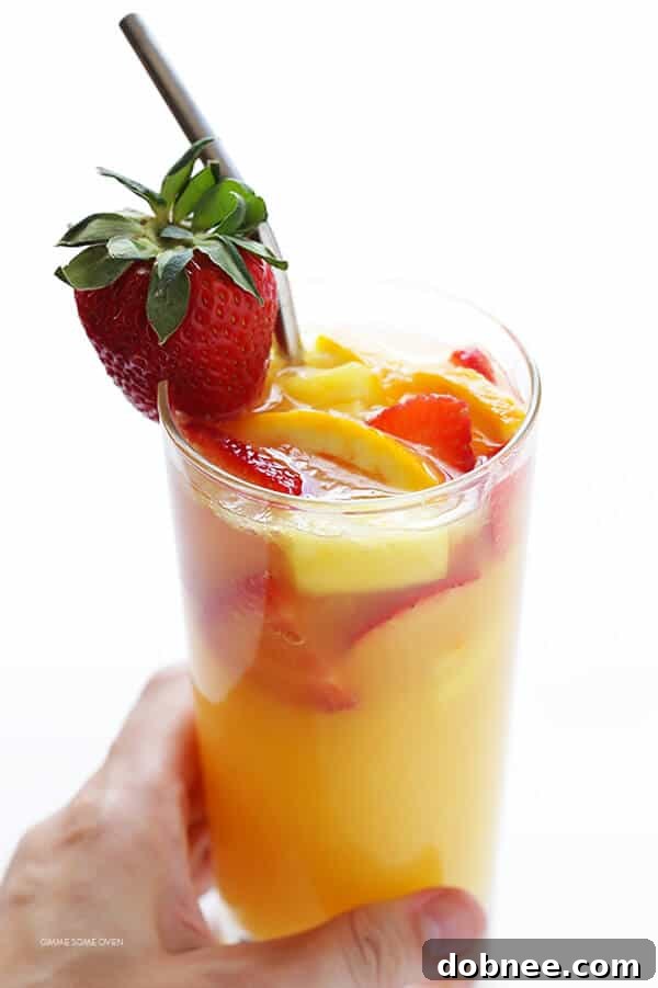 Mimosa Sangria -- quick and easy to make, and kicked up a notch with lots of delicious fresh fruit! | dobnee.com