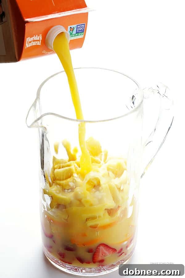 Mimosa Sangria -- quick and easy to make, and kicked up a notch with lots of delicious fresh fruit! | dobnee.com