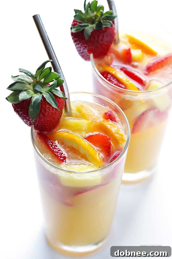 Mimosa Sangria -- quick and easy to make, and kicked up a notch with lots of delicious fresh fruit! | dobnee.com