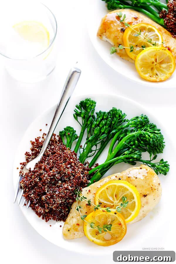 Zesty Lemon Roasted Chicken 3 Close-up of baked lemon chicken with fresh lemon slices and thyme