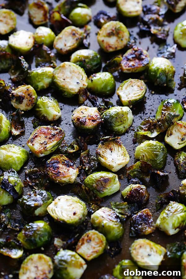 Crispy Miso Brussels Sprouts 3 Close-up of freshly roasted Miso Brussels Sprouts, showcasing their vibrant green and charred edges. (Gluten-Free, Vegan, Vegetarian)