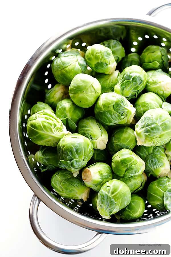 Crispy Miso Brussels Sprouts 4 Miso-coated Brussels sprouts ready for roasting on a baking sheet, featuring a rich, savory glaze. (Gluten-Free, Vegan, Vegetarian)