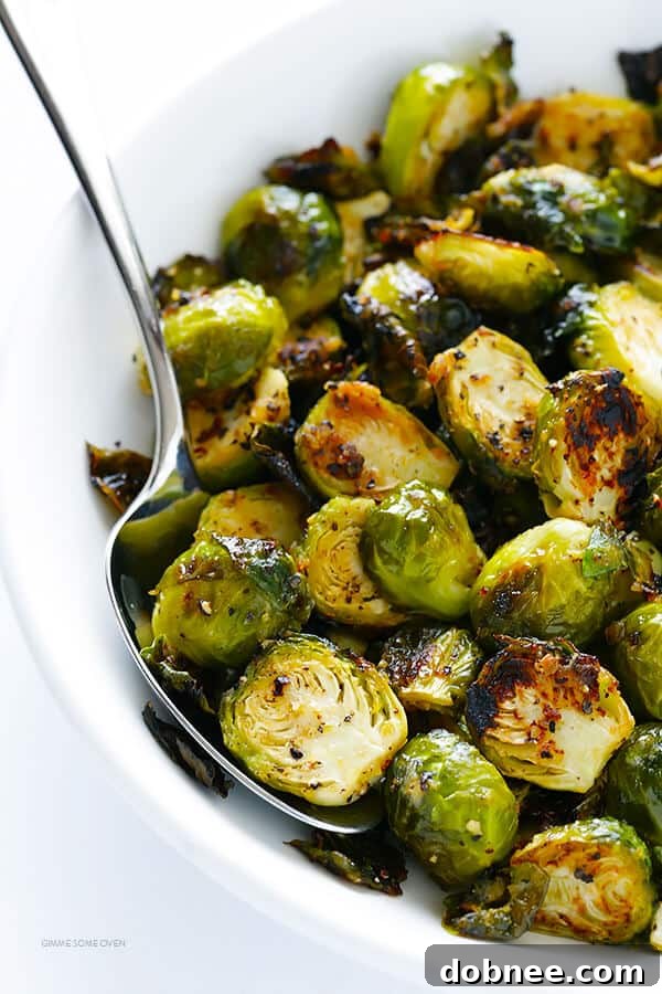Crispy Miso Brussels Sprouts 9 Miso Roasted Brussels Sprouts in a serving bowl, garnished with fresh herbs, ready to be enjoyed. (Gluten-Free, Vegan, Vegetarian)