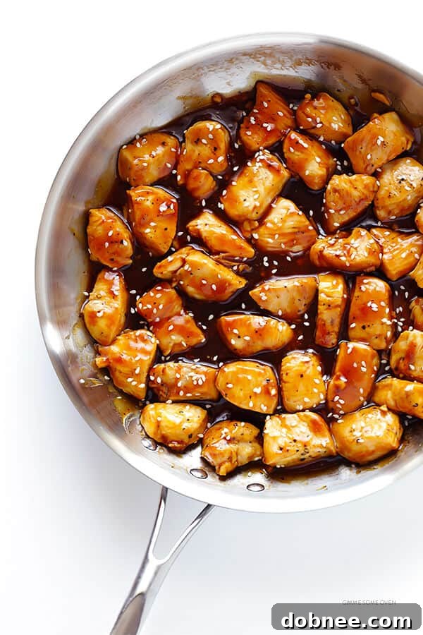 The delicious 20-Minute Teriyaki Chicken cooking in a skillet, with the rich homemade sauce just beginning to thicken and glaze the chicken pieces.