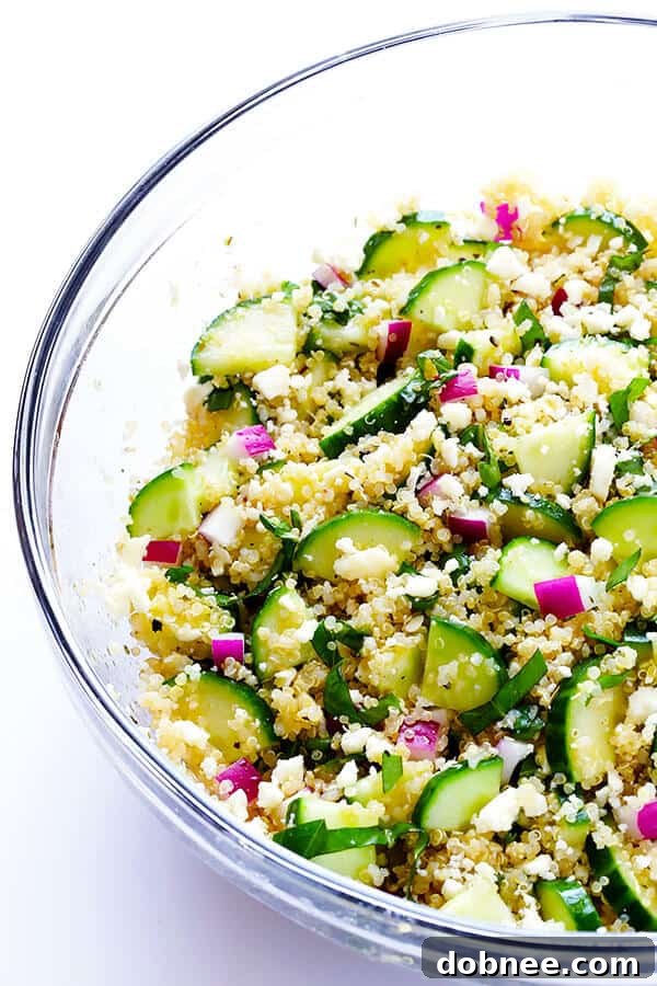 A close-up shot of the fully mixed Cucumber Quinoa Salad, showcasing the vibrant colors and fresh ingredients.