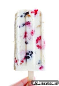 Delicious Berry Cheesecake Popsicles, a perfect summer frozen treat.