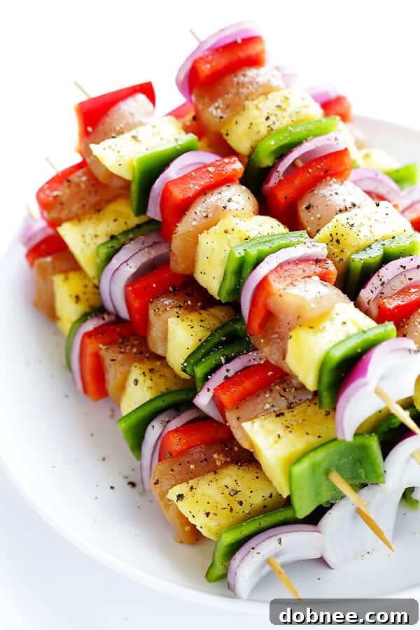 Close-up of cubed chicken marinating in a flavorful teriyaki sauce, ready for skewering.