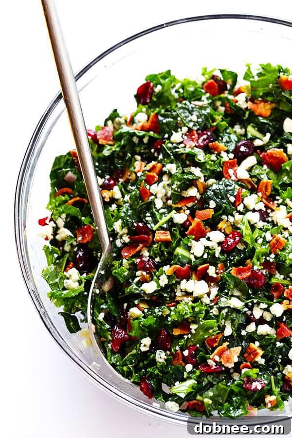 This vibrant Kale Salad with Bacon and Blue Cheese is incredibly quick and easy to prepare. It's tossed in a delicious red wine shallot vinaigrette, offering a perfect blend of sweet, savory, and tangy flavors. An ideal make-ahead option, it stays fresh for hours in the fridge! | dobnee.com