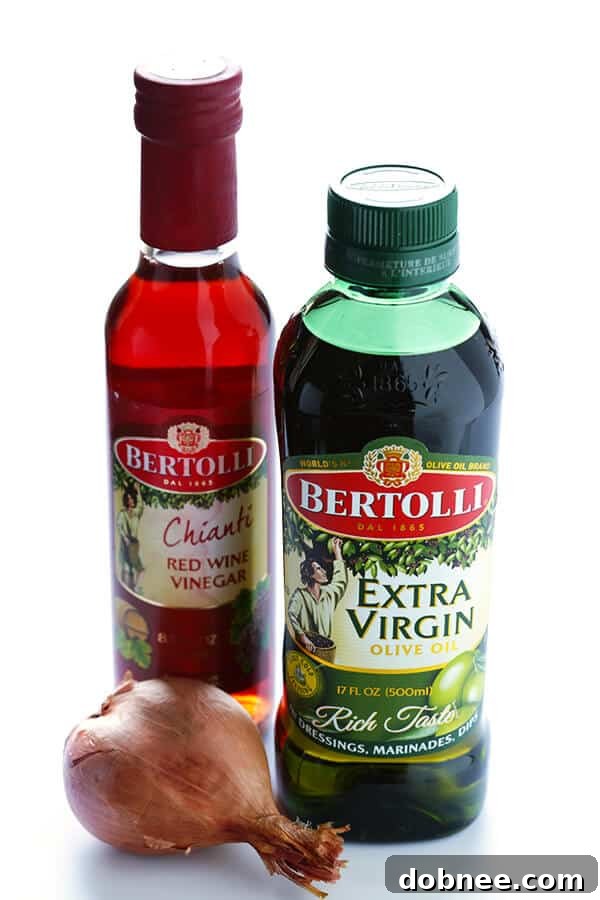 This Kale Salad with Bacon and Blue Cheese is quick and easy to make, tossed with a red wine shallot vinaigrette, and TOTALLY delicious. (Bonus, it holds up for hours in the fridge, if you want to make it ahead of time!) | gimmesomeoven.com