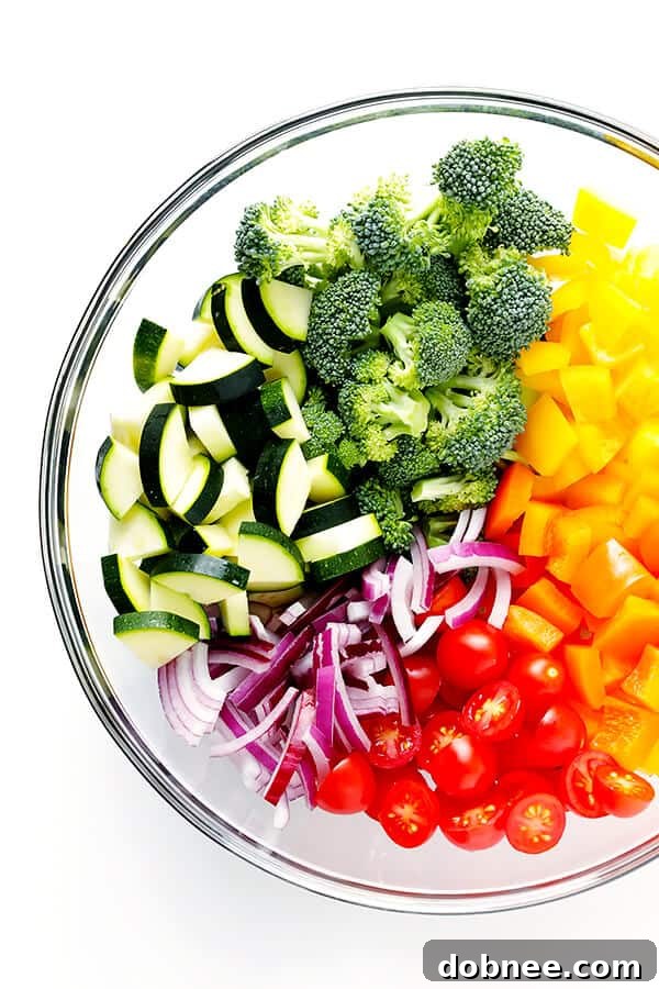 Close-up shot of Veggie Lovers' Pasta Salad, showcasing the colorful vegetables and pasta coated in a delicious vinaigrette.