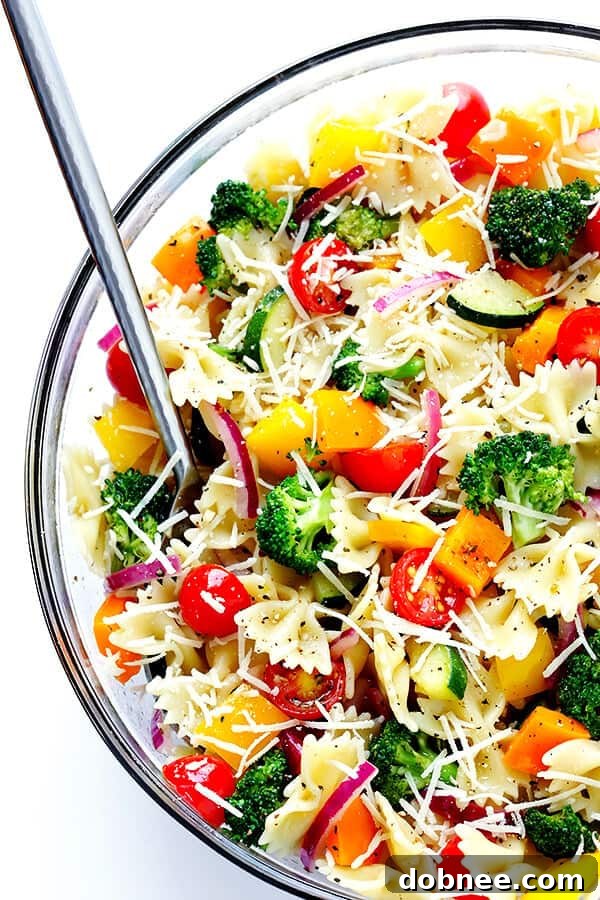 A beautifully presented bowl of Veggie Lovers' Pasta Salad, garnished and ready to be served and enjoyed.